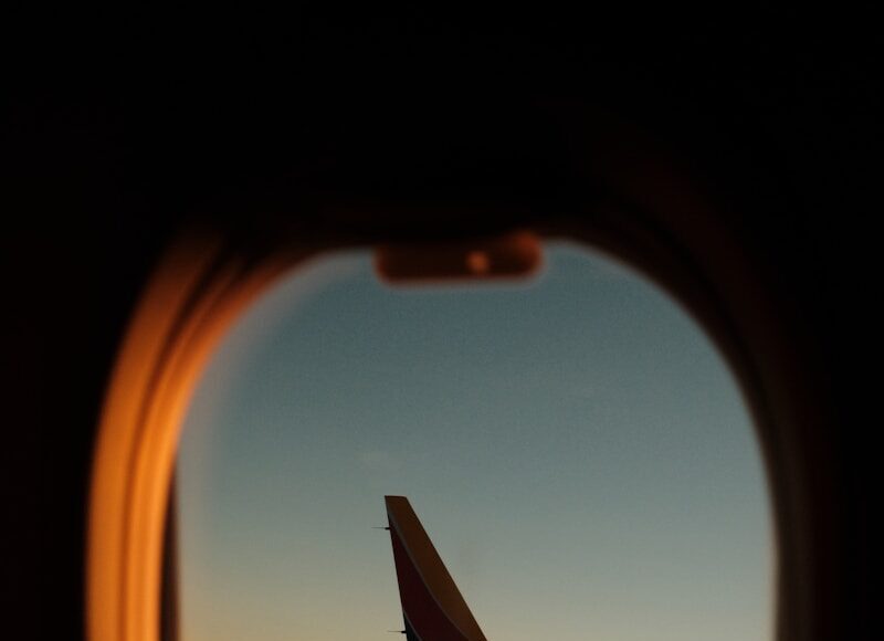Photo by Patrick Konior a view of the wing of an airplane through a window