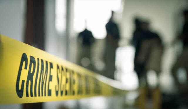 Crime,Scene,Tape,With,Blurred,Forensic,Law,Enforcement,Background,In