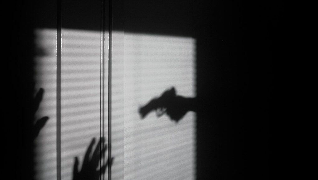 silhouette of person on window